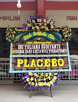 Karangan bunga papan ucapan duka cita
